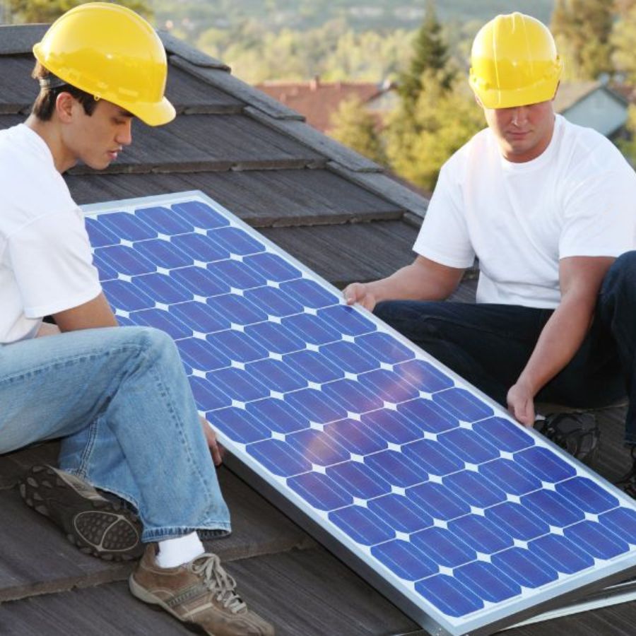 top solar installers Vancouver installing solar panels on a roof